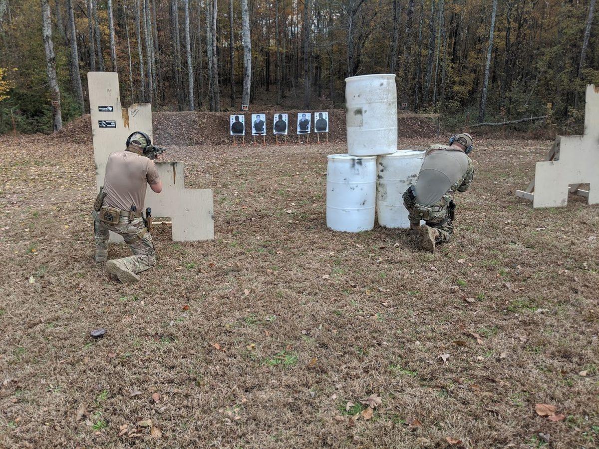 Students training behind barricades on an outdoor range