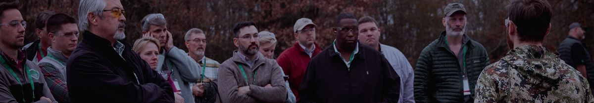 Civilians attending an outdoor suppressor education event